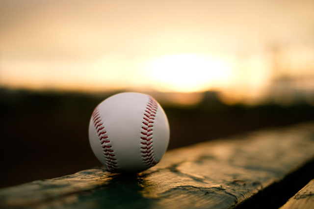 Baseball at sunset.