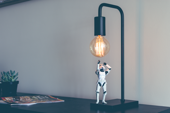 Stormtrooper having an idea while standing under a lamp.